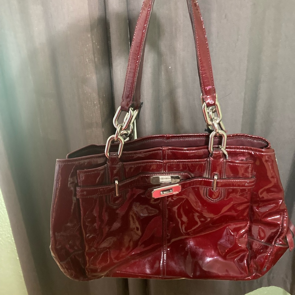 Small shiny red coach bag. Second hand.